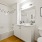 bright bathroom with shower and tub